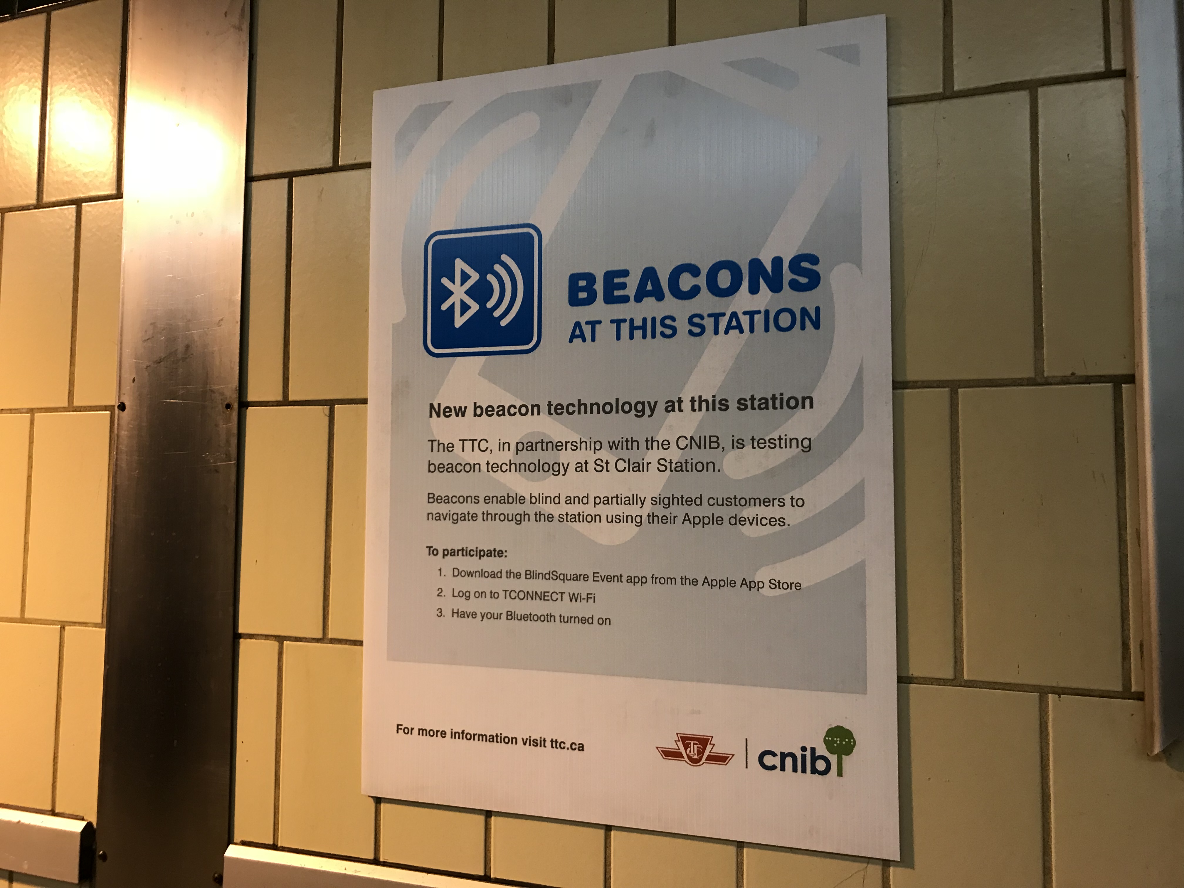 A poster at St. Clair station, mentioning the availability of beacon technology at this station, and instructions to use it.
