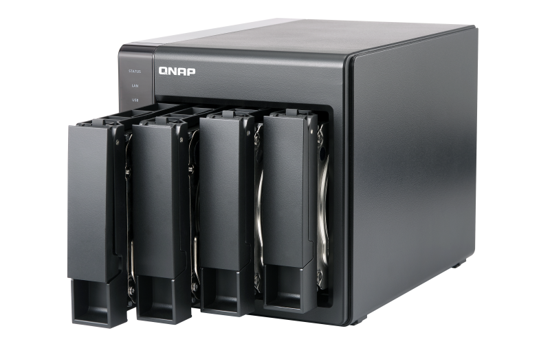 4-disk QNAP NAS device with drive caddies slightly pulled out.