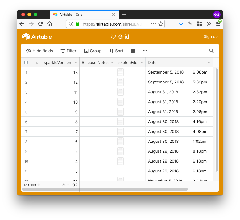 The Airtable grid with 4 fields; sparkVersion for version number as primary field and auto-incrementing numbers, an empty Release Notes field, an attachment field that has the files, and a date field that auto generates dates. There are 13 lines filled in the table.