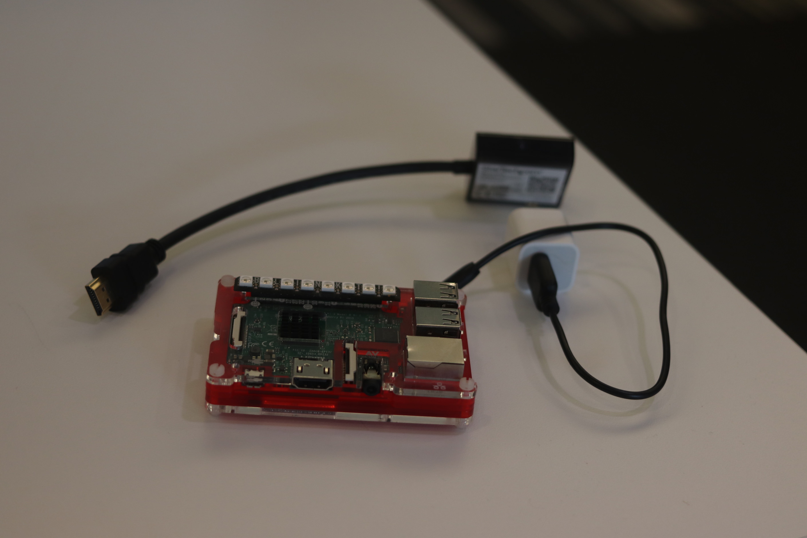Raspberry Pi, USB power brick and cable, and an HDMI to VGA adapter.