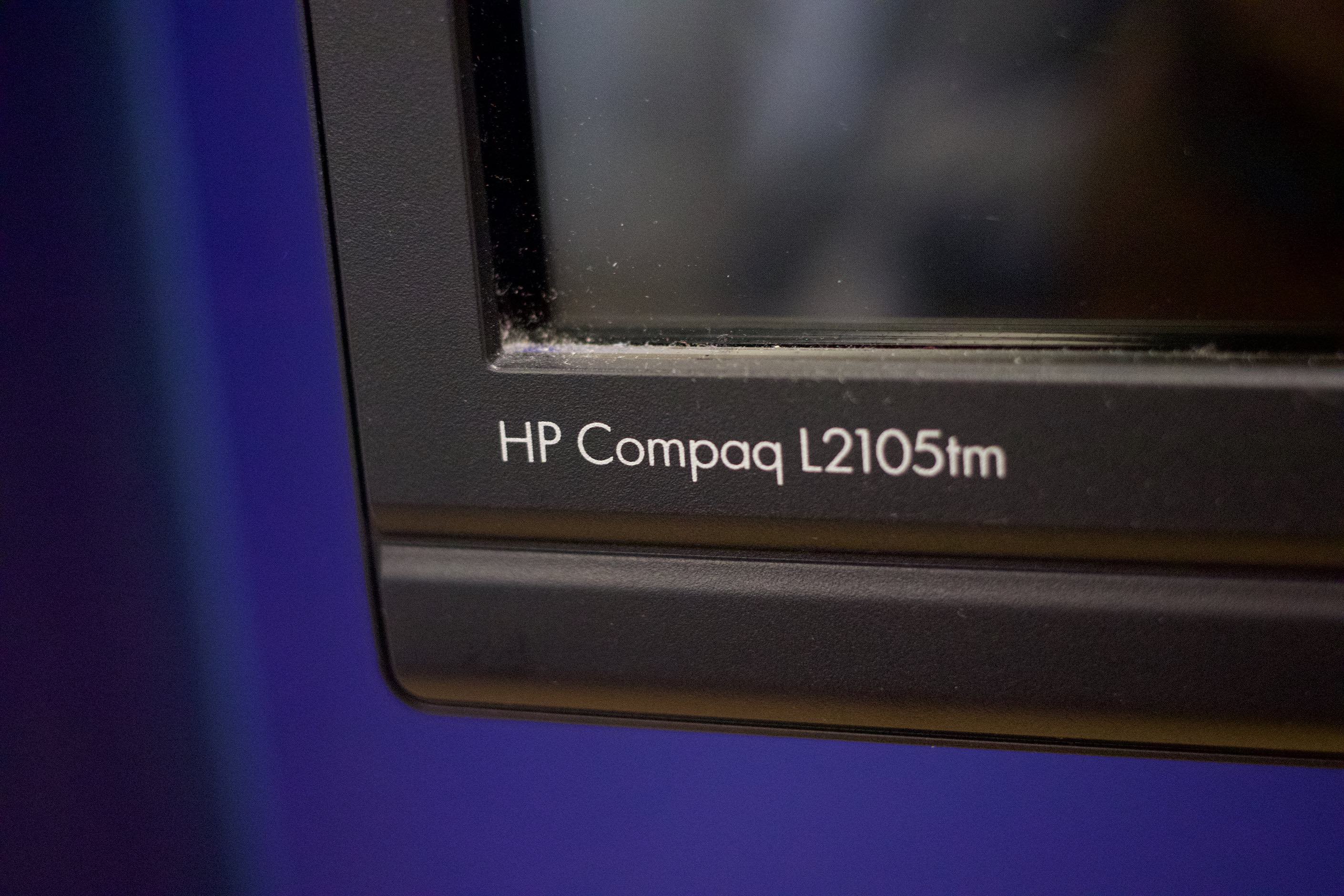 'HP Compaq L2105tm' printed on the bezel of display.