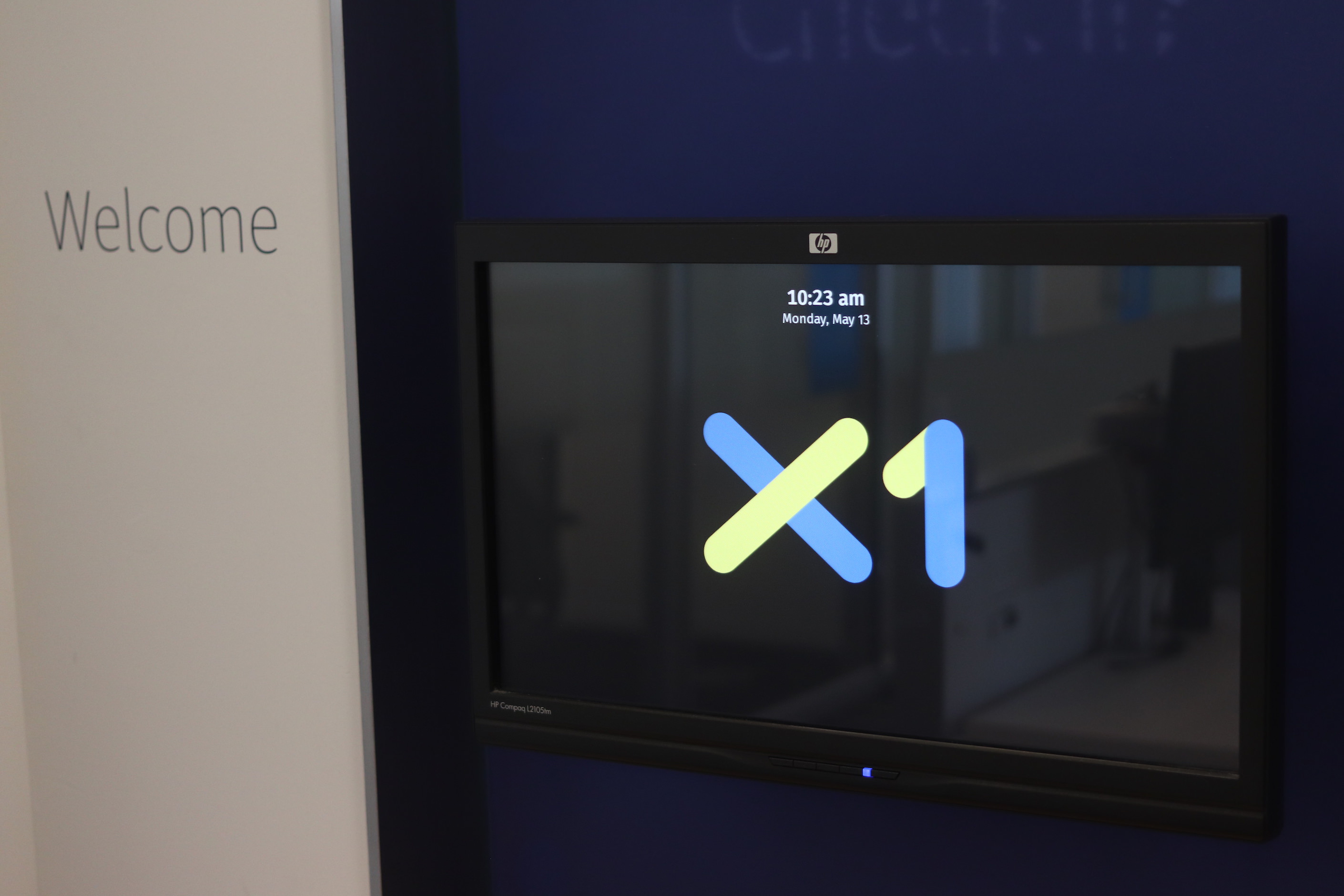 The display showing the date, time, and the X1 logo.